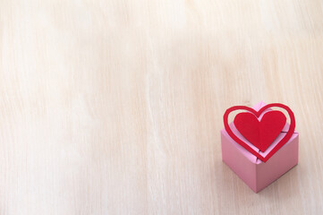 Gift wrapping. A gift with a heart. Holiday present.