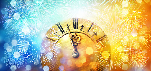Fototapeta na wymiar Blue and yellow circular reflections and a clock showing the beginning of the New Year. Blurred light of Christmas and New Year. Winter abstract background defocused.
