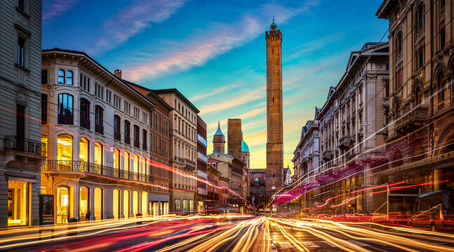 Two famous falling Bologna towers Asinelli and Garisenda. Evening view. Bologna, Emilia-Romagna, Italy. Long exposure, time lapse.