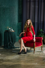 woman in red dress sitting on chair