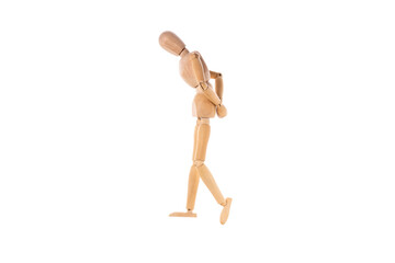 wooden man walks sad with his hands behind his back isolated on white background