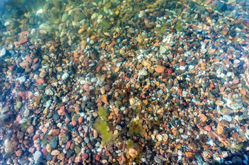 Sea rocks under the water. Texture sea pebbles. Natural stone background.