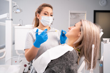doctor woman holding syringe with dental anesthesia. Medicine, dentist and healthcare concept....