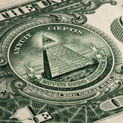 one american dollar with pyramid and eye close-up