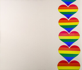 LGBT rainbow hearts pattern. A heart cut out of paper. Rainbow of LGBT colors.