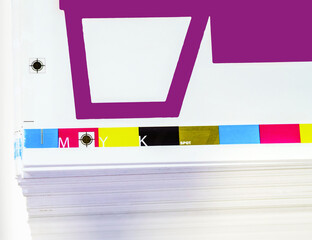 Sheets of printed products. Offset printing. CMYK press. Paper at the printing house.