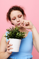 beautiful woman flower in white pot posing emotion isolated backgrounds unaltered