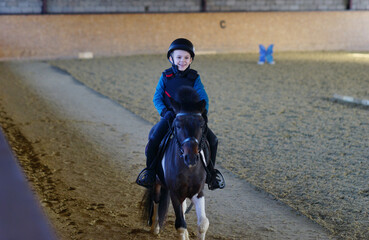 person riding pony. Equestrian. Child horseback riding. Dressage 
