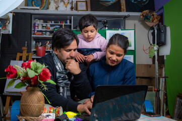 parents teaching our child from laptop .
