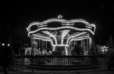 The carousel moving at night time. Black and white