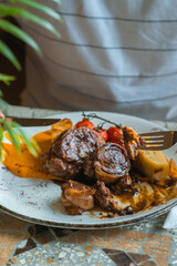 Eating delicious lamb rolls.
