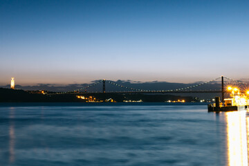 25 april bridge illuminated in lisbon