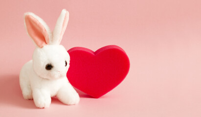 happy valentines day cute bunny toy and sponge red heart  greeting card copy space