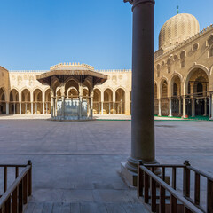 Ablution fountain mediating the courtyard of public historic mosque of Sultan al Muayyad, with...