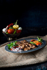 turkish  kebab and vegetable on the dark background