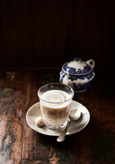 Coffee with milk on dark background. Soft focus. Copy space.