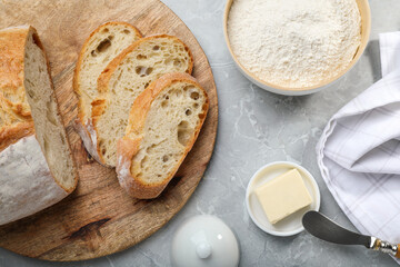 Flat lay composition with freshly baked sodawater bread on light grey marble table