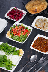 turkish kebab appetizers, salad, lavash,  on the dark bacground
