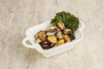 Tasty marinated mussels in the bowl