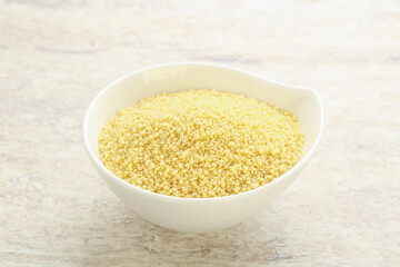 Raw couscous in the bowl