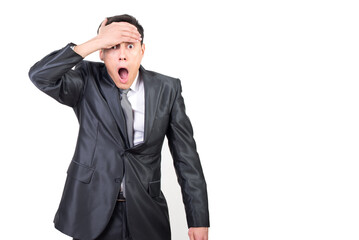 Shocked man in elegant suit looking at camera