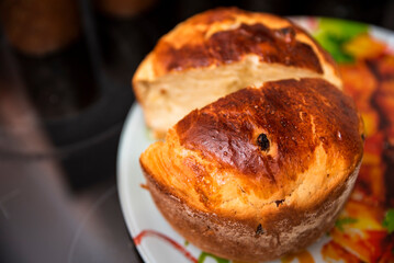 bun with raisins on the table, horizontal photo