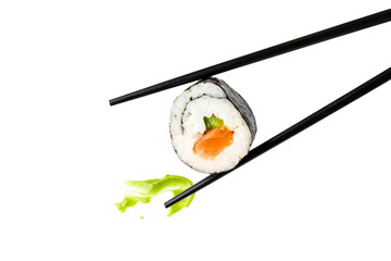 California sushi with avocado and salmon and black chopsticks and wasabi sauce splash isolated on white