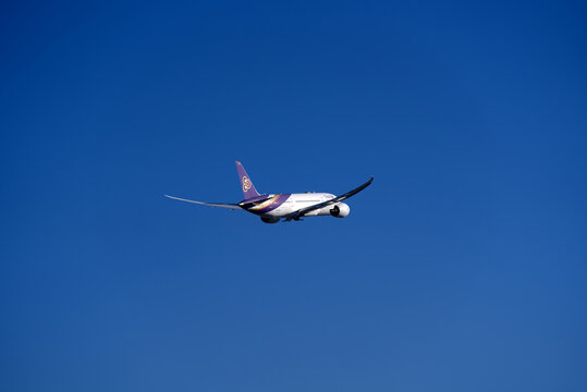 Thai Airways airplane Boeing 787-8 Dreamliner register HS-TQF up in the sky shortly after take off from Zürich Airport on a sunny winter day. Photo taken January 26th, 2022, Zurich, Switzerland.