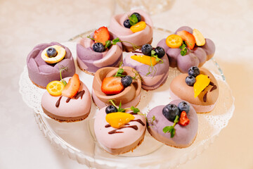 cakes souffle with fresh berries. portioned desserts for the banquet. confectioner's services. candy bar