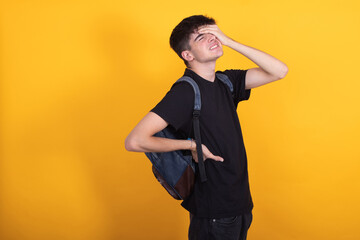 isolated student with backpack with back pain