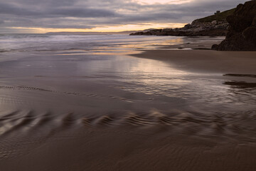 Fototapeta na wymiar Freathy Beach in Whitsand Bay South East Cornwall at sunset and low water