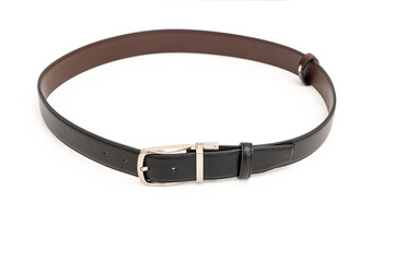 Double-sided black and brown leather belt with an unbuttoned buckle on a white background.