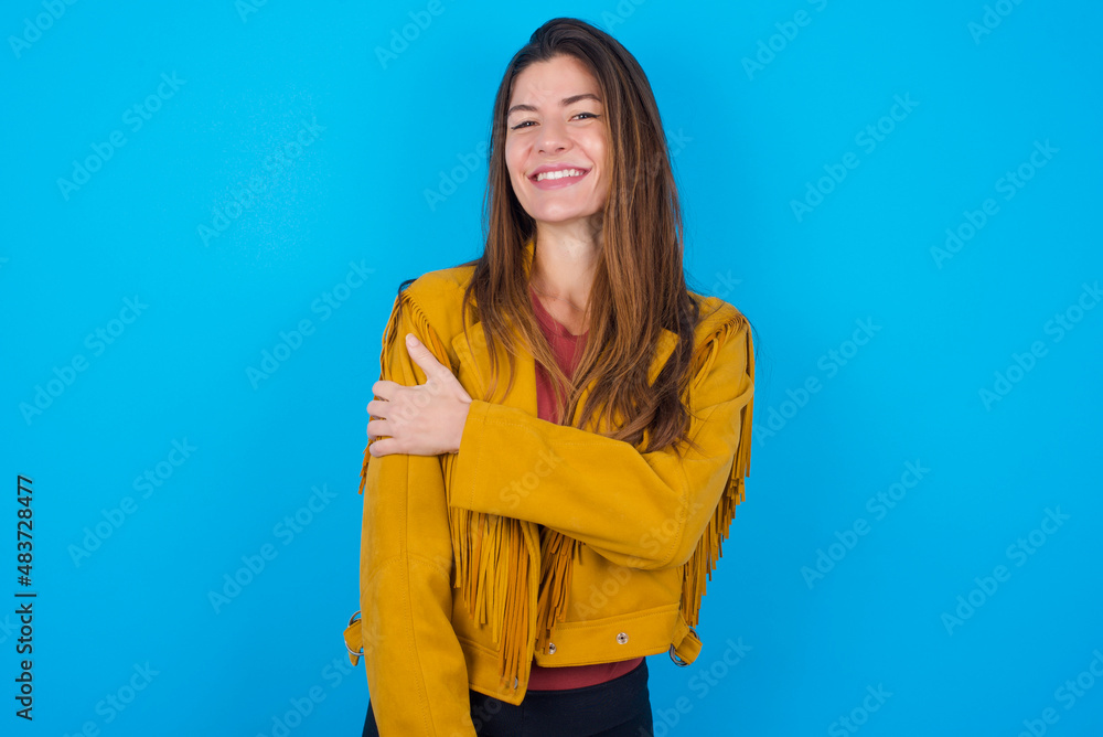 Wall mural people, lifestyle, youth and happiness concept. shy pretty young caucasian woman wearing yellow frin