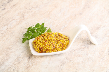 Grain mustard sauce in the bowl