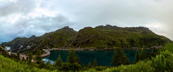 Fototapeta premium Fedaia Stausee, Dolomiten, Südtirol, Italien. Lago di Fedaia, Dolomites, South Tyrol, Italy 
