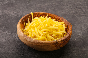 Shredded yellow cheese in the bowl