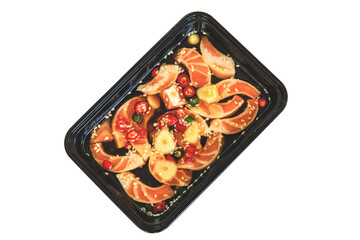 salmon raw marinated with Korean soy sauce and red chili in transparent plastic box for food delivery, salmon pickled.