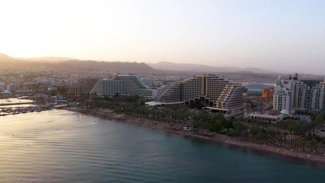 Luxury hotels and resorts by red sea beach at Eital city in south Israel, golden hour 