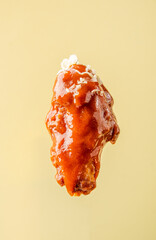buffalo wing in sauce, on a bright background, BBQ wing