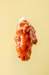 Poster buffalo wing in sauce, on a bright background, BBQ wing © Alexandr Milodan