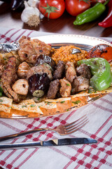 turkish mix kebab, salad, lavash, buttermilk, on the dark bacground