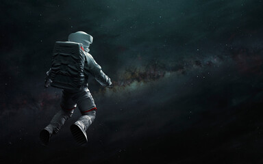 Astronaut at spacewalk looks at Milky Way. Elements of image provided by Nasa © Vadimsadovski