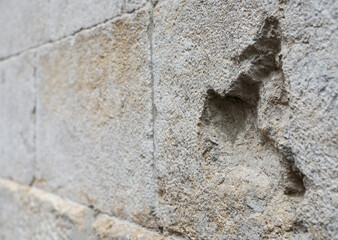 Old dirty brick wall, perspective view, selective focus.