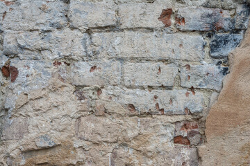 Old brick wall. Old brickwork with traces of destruction.