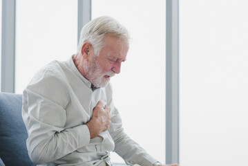 Senior elderly man get heart attack with unhappy and painful emotion.
