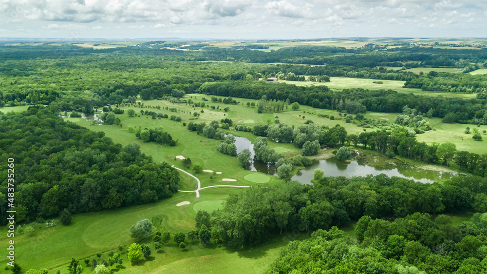 Wall mural drone view of a beautiful golf course