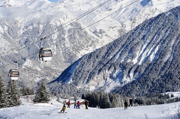 Vintage ski gondolas in a ski resort by winter