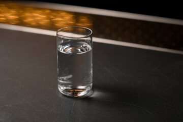 Close up photo of alcoholic shot on grey bar counter