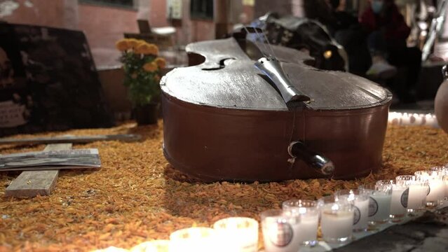Violin and candles on an altar 
