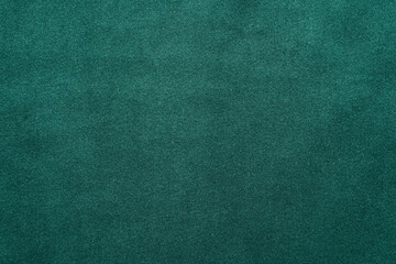 Green fabric background, view from above